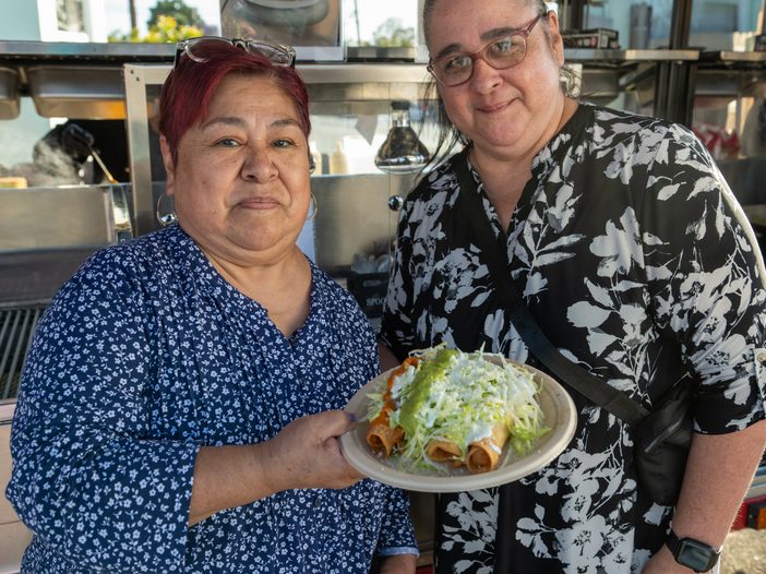 El Mercadito Fest attendees enjoy enchiladas